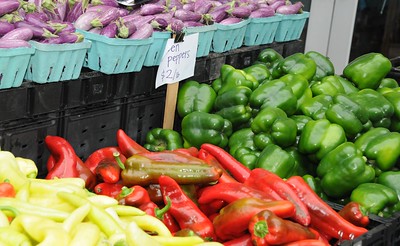 "Tomatoes, Peppers, and Eggplant from the Columbia Heights Community Marketplace" by hfobia is licensed under CC BY 2.0.